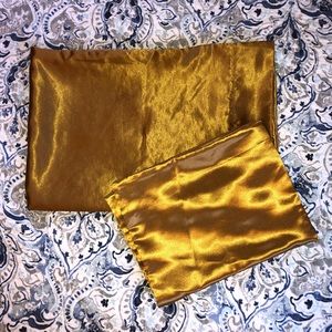 Two golden silk pillowcases